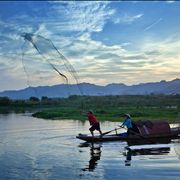 Picture Of Fishermen With Net At Lake